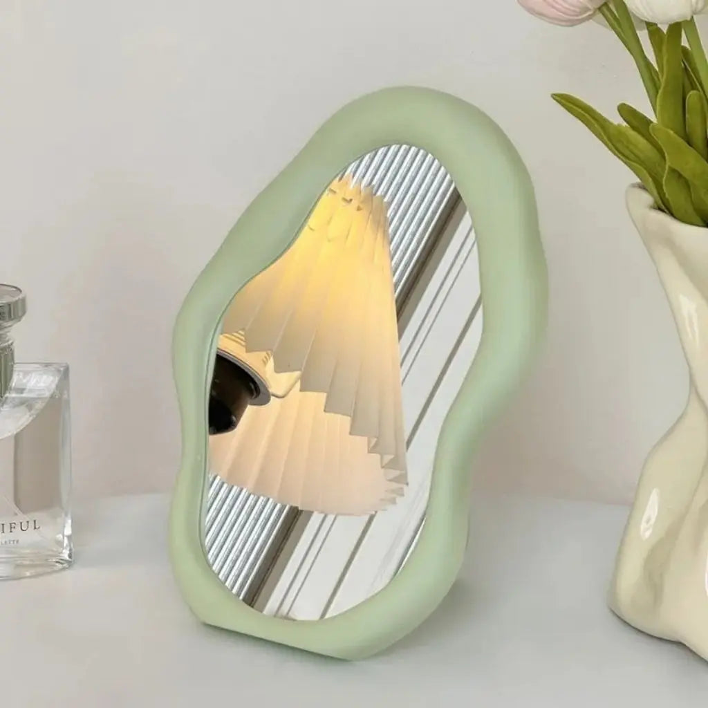 Desktop cloud mirror with stand function featuring sculptural design for modern vanity setups