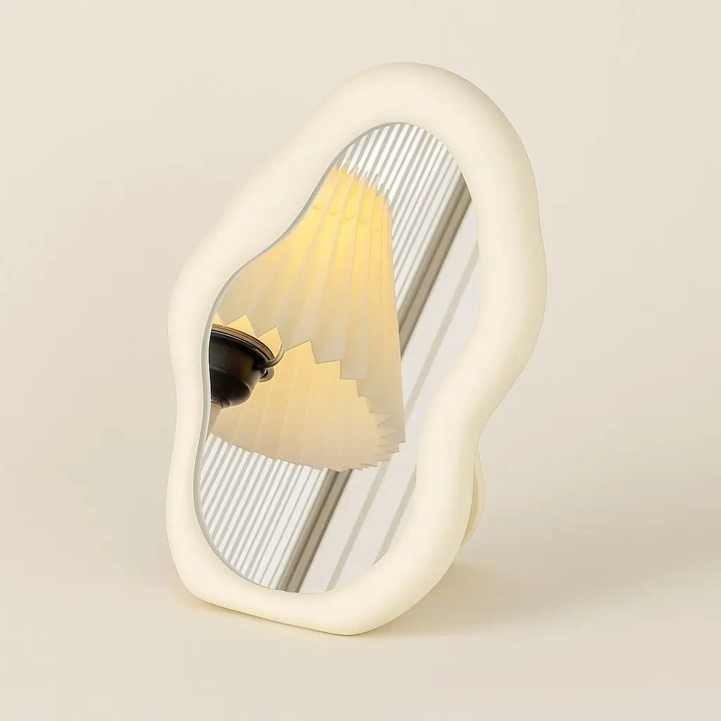 Sculptural cloud mirror mounted on wall showcasing modern irregular shape for contemporary home styling