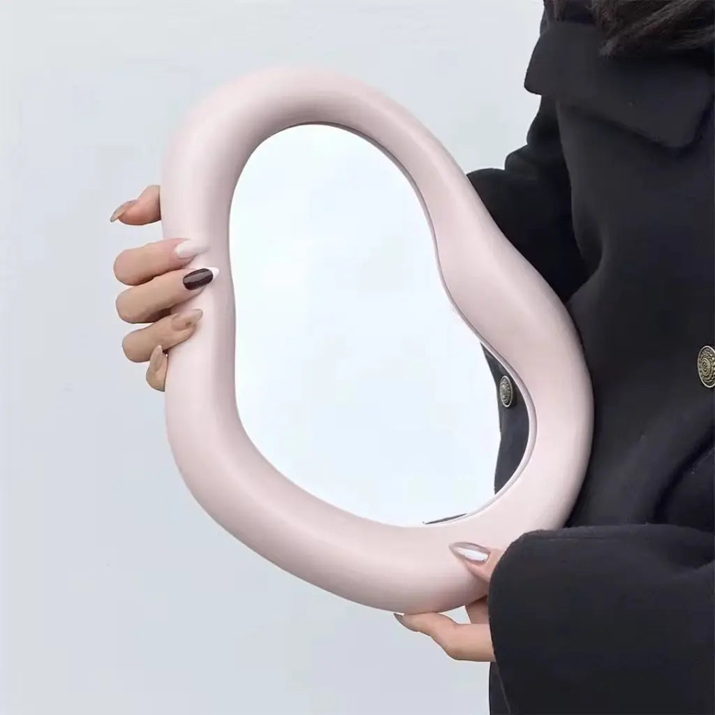 Sculptural cloud mirror with irregular organic shape ideal for desktop vanity and wall display