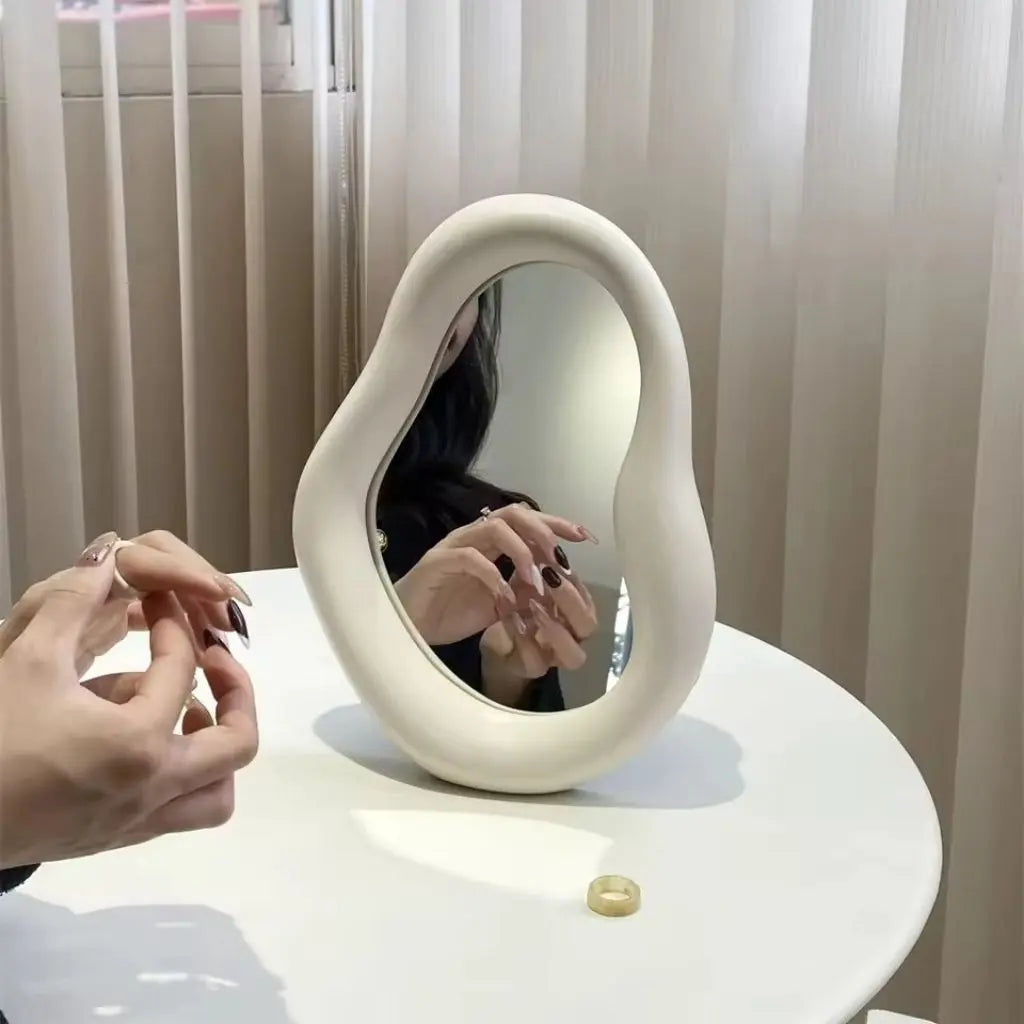 Versatile cloud mirror with organic irregular shape combining vanity function and sculptural home accent