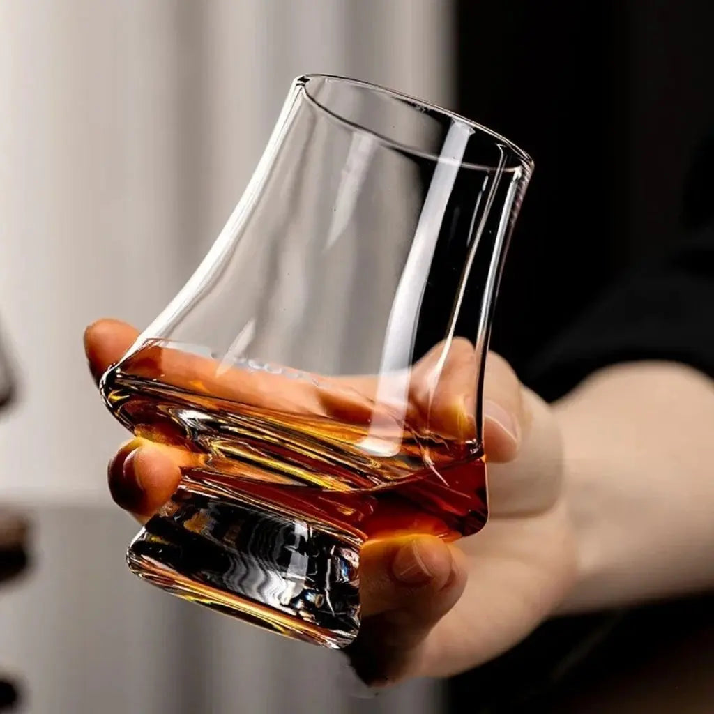Crystal whiskey glass with curved bowl design enhances whiskey and spirits tasting experience