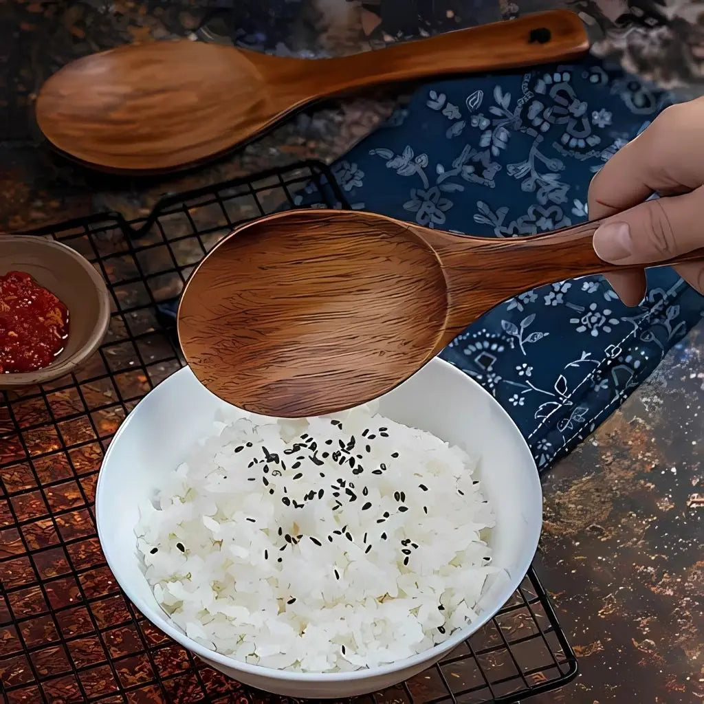 Natural wooden cooking utensil set featuring heat-resistant tools for healthy meal preparation