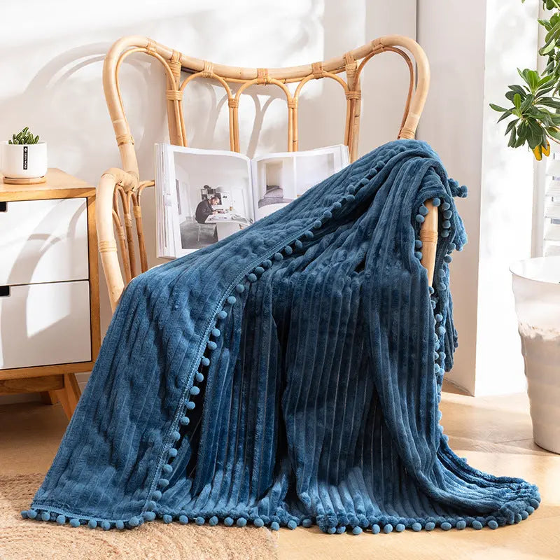 Pom detail throw with striped velvet texture ideal for lounging and home comfort