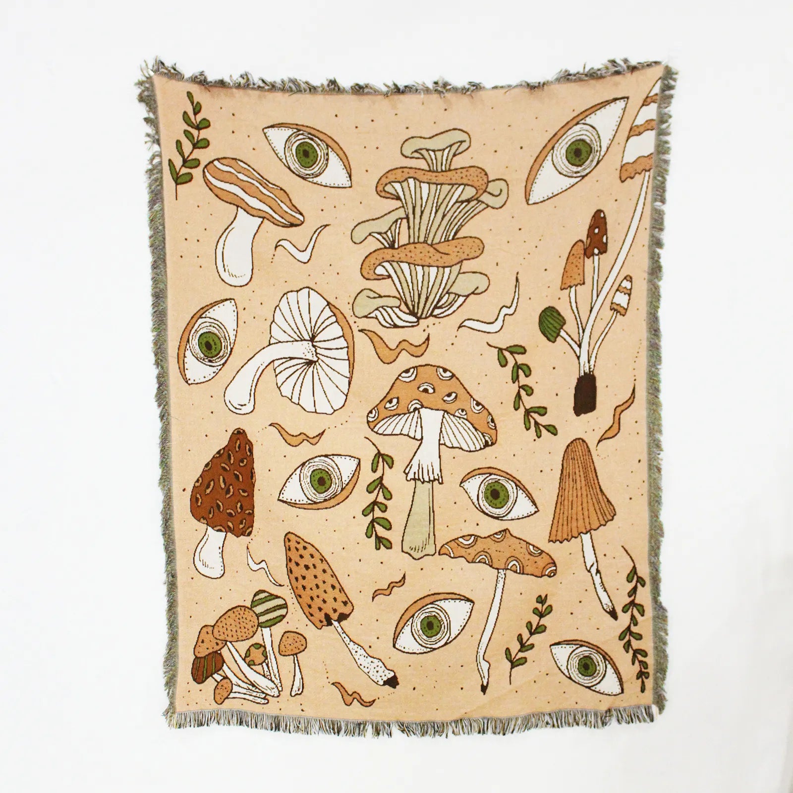 Beige blanket with mushroom and eye pattern on a white background