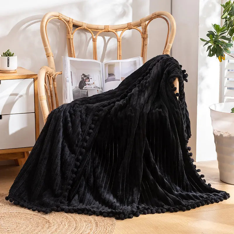 Pom pom throw blanket with decorative fringe edges perfect for sofa and living room decor