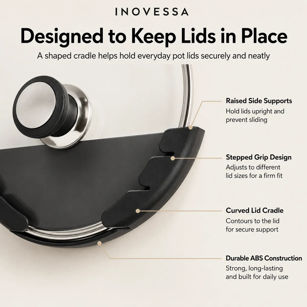 Inovessa black pot lid cradle shown on a light beige background with callout text explaining its raised side supports, stepped grip design, curved lid cradle, and durable ABS construction.