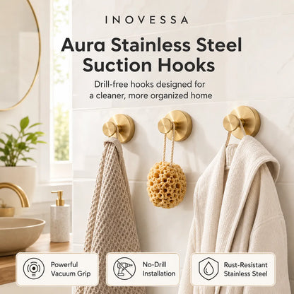 Inovessa Aura Stainless Steel Suction Hooks in a bathroom setting with towels and a sponge.