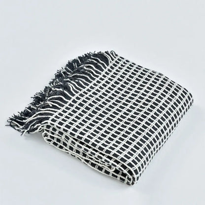 Lightweight tassel throw blanket with versatile design for travel and seasonal comfort