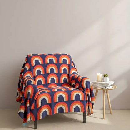 Rainbow knit blanket with multicolor arch pattern made from soft cotton for home decor
