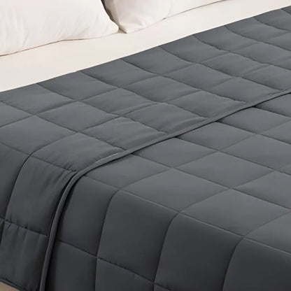 Natural cotton blanket with plain design and neutral color for versatile bedroom decor and comfort