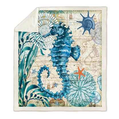 Warm coral fleece blanket with coastal ocean design and plush texture