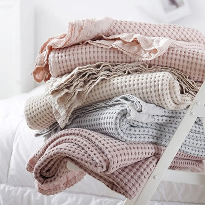 Cotton quilt blanket with waffle design and lace accent for layering