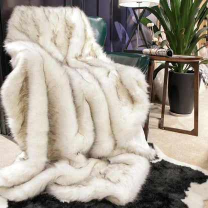 Textured faux fur throw blanket with smooth plush surface for warmth
