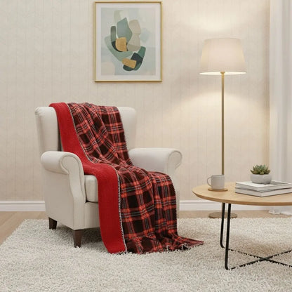 Plaid fleece blanket in red checkered pattern with soft flannel surface