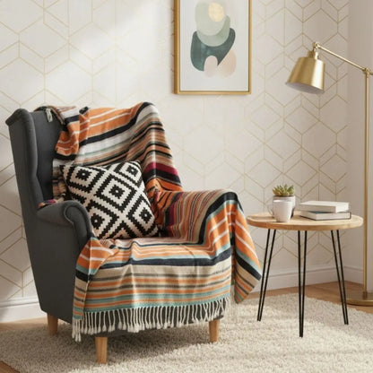 Acrylic blanket with tassel edges and vibrant striped design for cozy layering