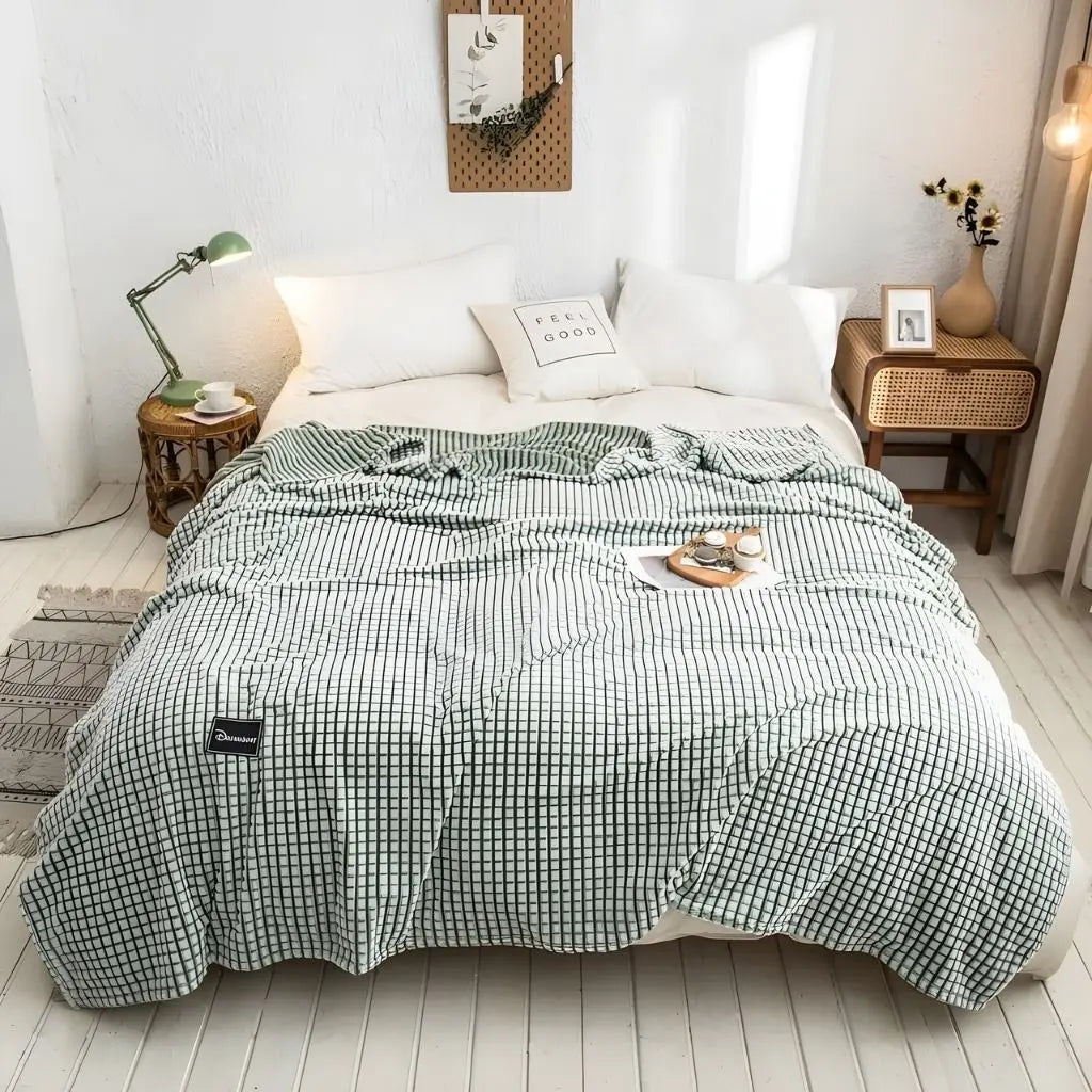Soft polyester throw blanket draped on sofa for cozy living room comfort and relaxation
