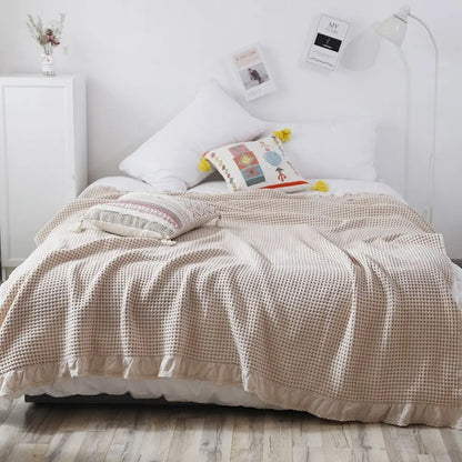 Soft waffle cotton quilt featuring lace detail for cozy home textiles