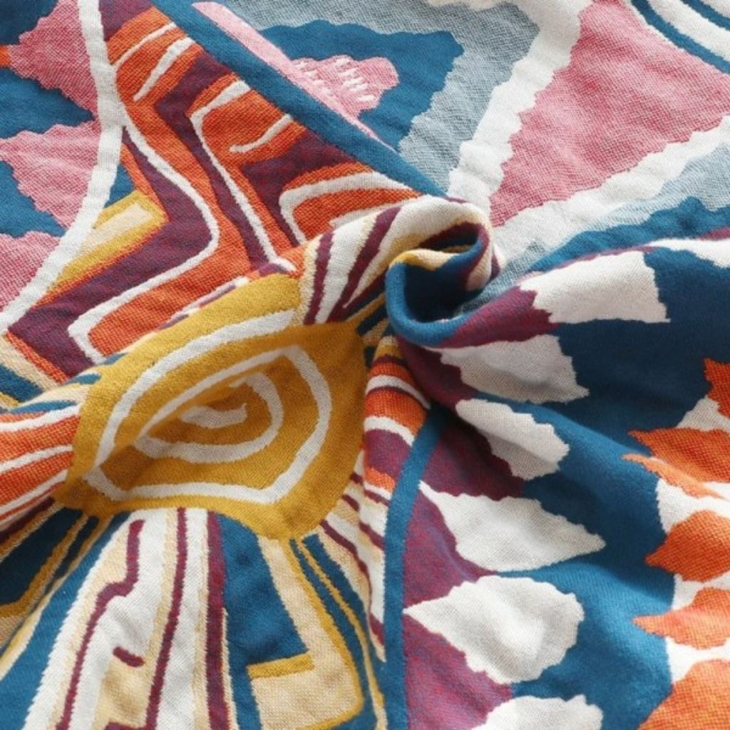 Breathable woven cotton throw blanket with soft texture for year round comfort and layering