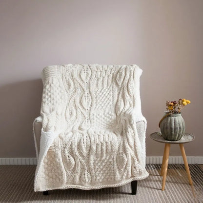 Handwoven Icelandic wool blanket with intricate textured pattern for home decor and sofa layering