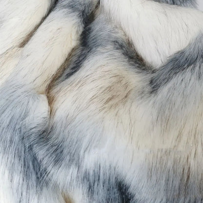 Soft faux fur throw blanket folded to show texture and quality for bedroom comfort