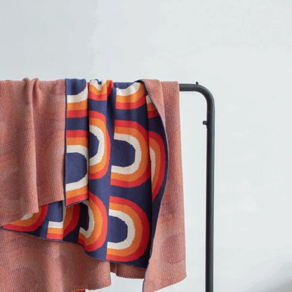 Lightweight cotton rainbow knit blanket suitable for year round decorative and functional use