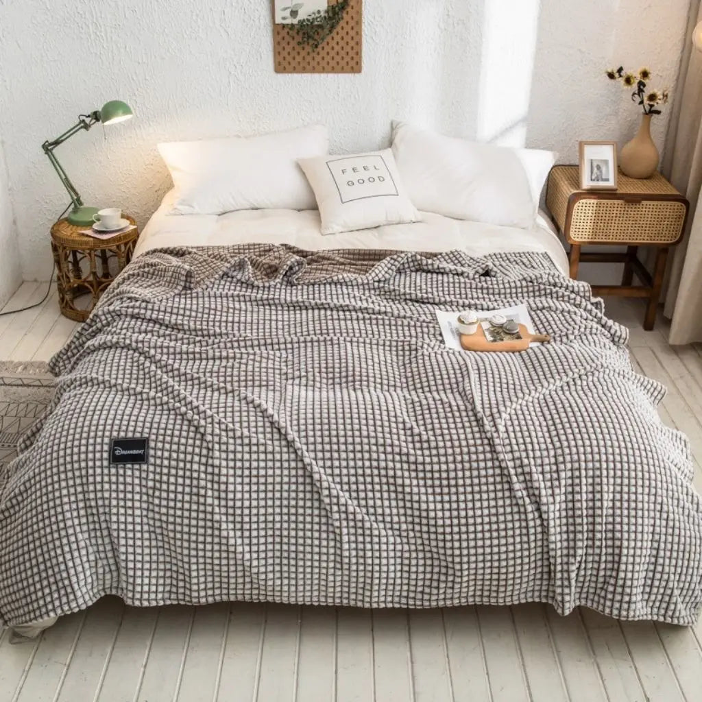 Polyester throw blanket showing size and drape for beds sofas and versatile home use