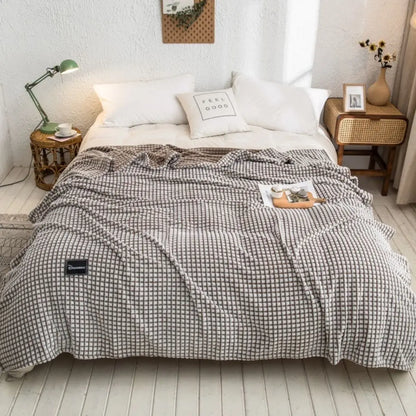 Polyester throw blanket showing size and drape for beds sofas and versatile home use