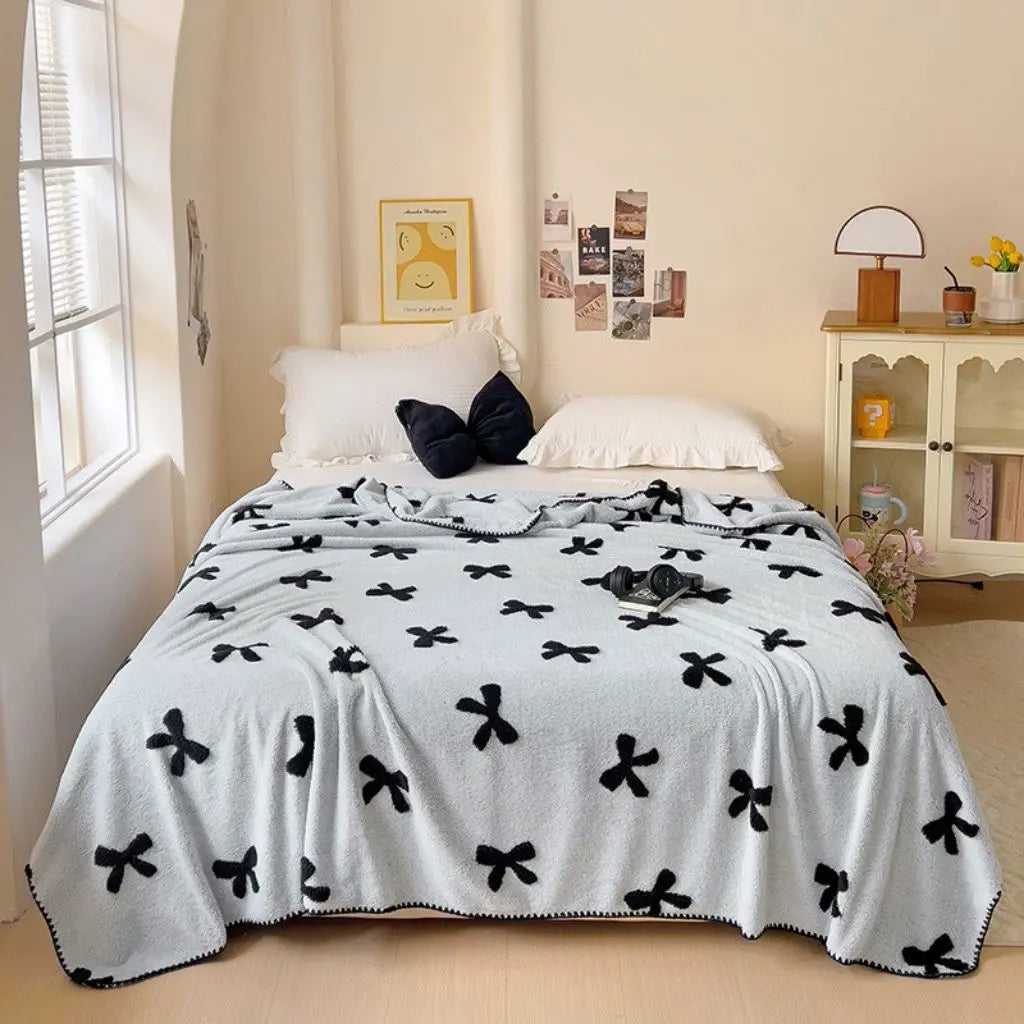 Lightweight bamboo fleece throw blanket with plush texture for sofa and bed use