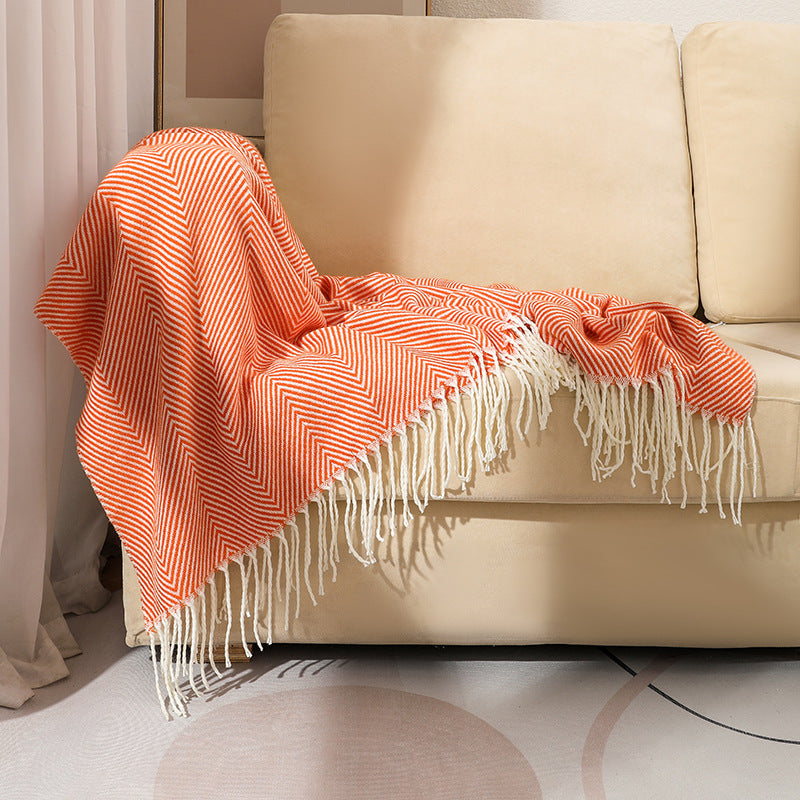Herringbone weave throw blanket with decorative fringe for living room and bedroom use