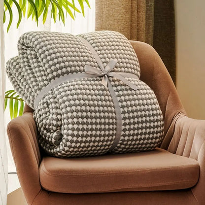 Neutral colored wool throw blanket with modern weave pattern for versatile home comfort