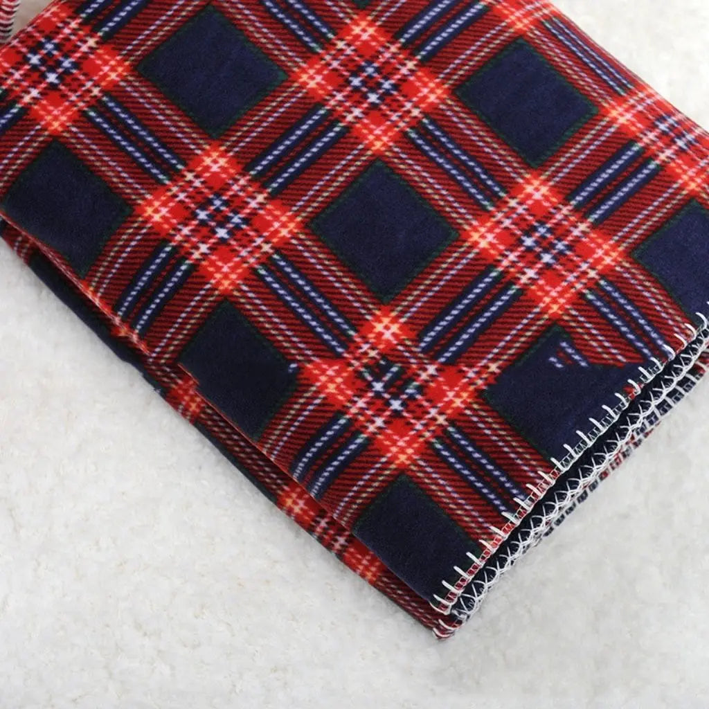 Plaid blanket for bed in red flannel with fleece insulation layer