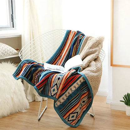 Soft fleece throw featuring vibrant geometric pattern design perfect for indoor relaxation