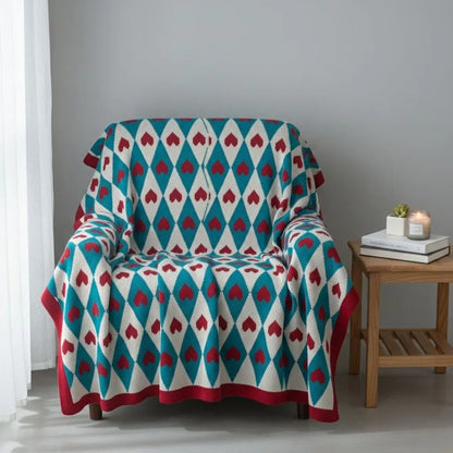 Geometric acrylic knit throw blanket with bold pattern and contrasting tones for sofa decor