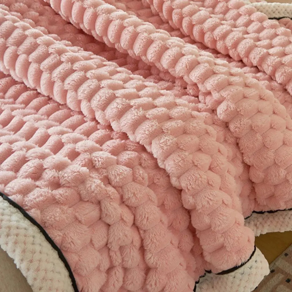 Thick plush velvet throw blanket showing luxurious texture and substantial weight for beds and sofas