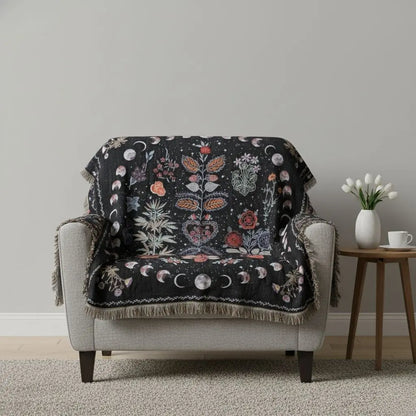 Celestial woven throw displaying tarot moon symbolism with bohemian fringe details for spiritual decor
