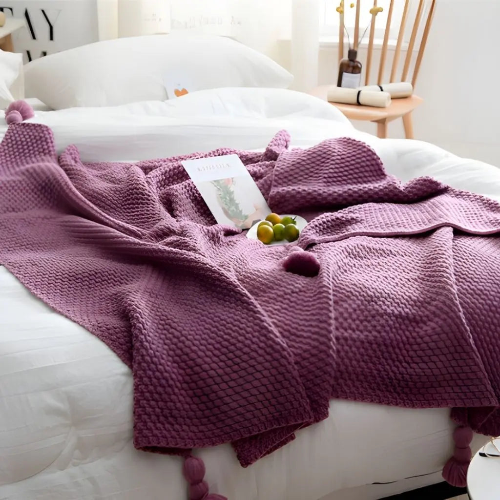 Textured throw blanket with decorative tassels for modern living room styling