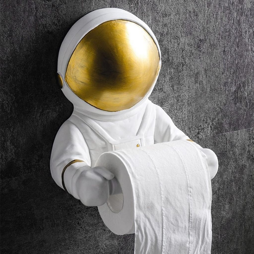 Astronaut holding a roll of toilet paper against a dark background