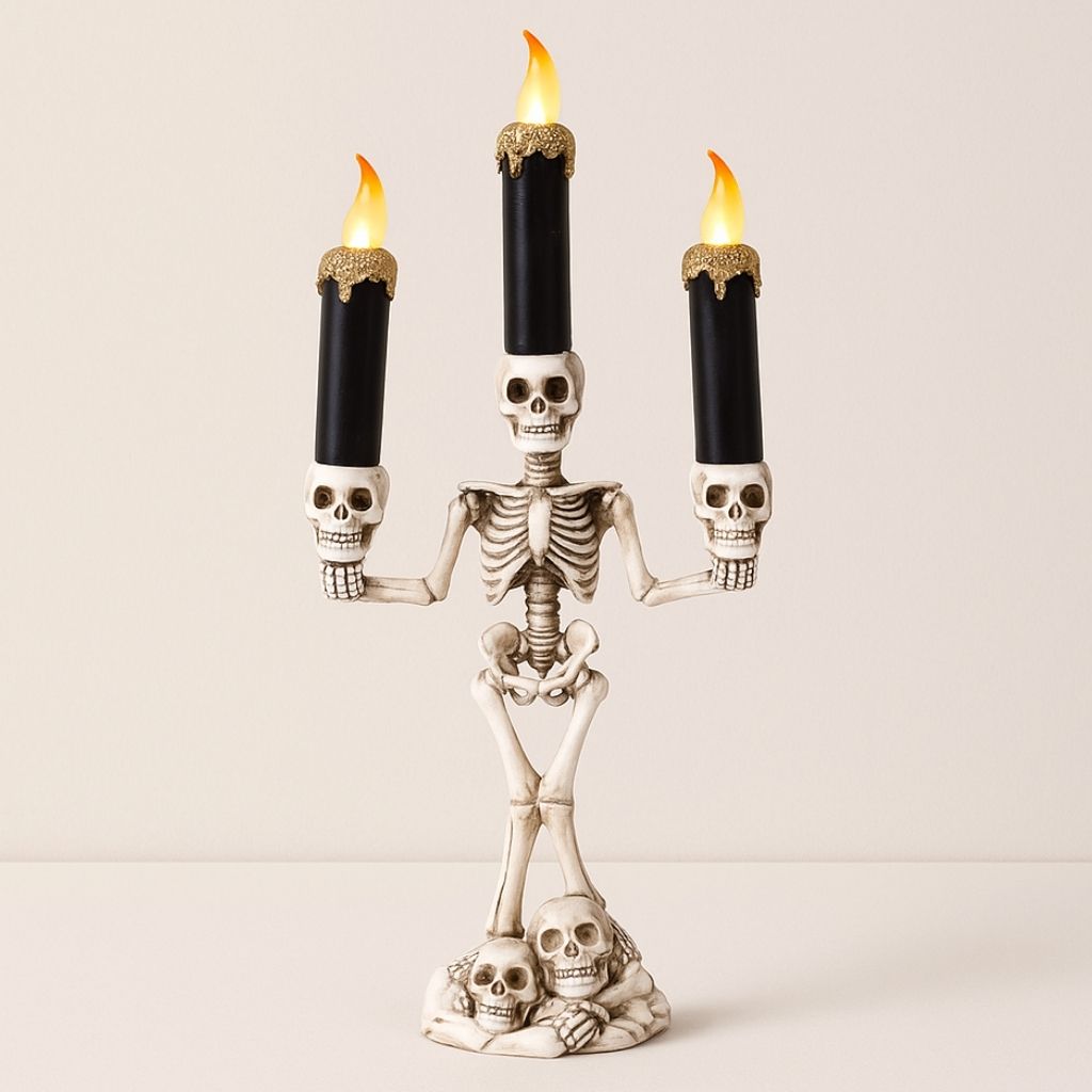 Skeleton candelabra with three LED candles on a white background