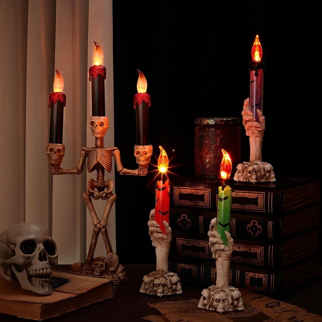 Skeleton candle holder with three LED flames, detailed bone structure for Halloween home decor displays
