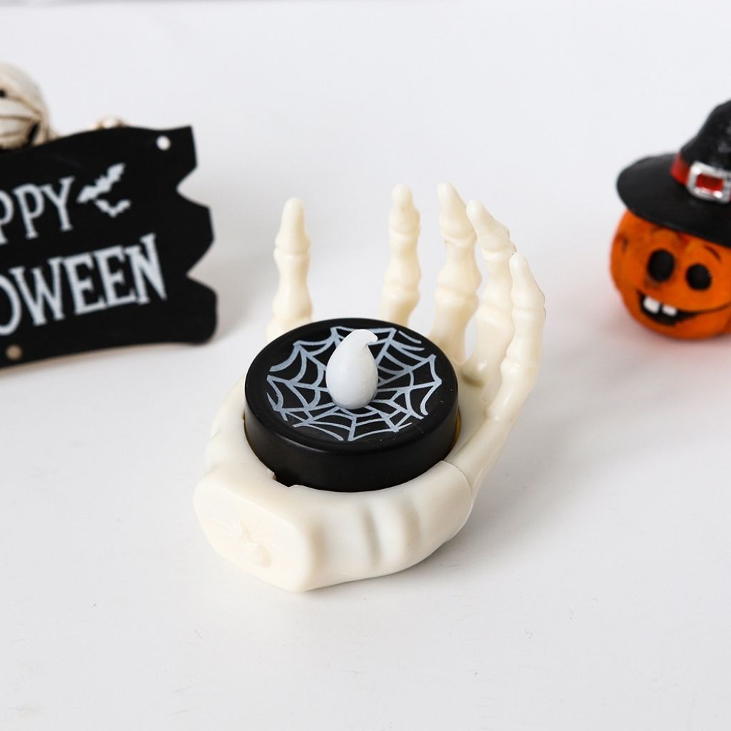 Halloween-themed LED lamp with spider web design on a white background