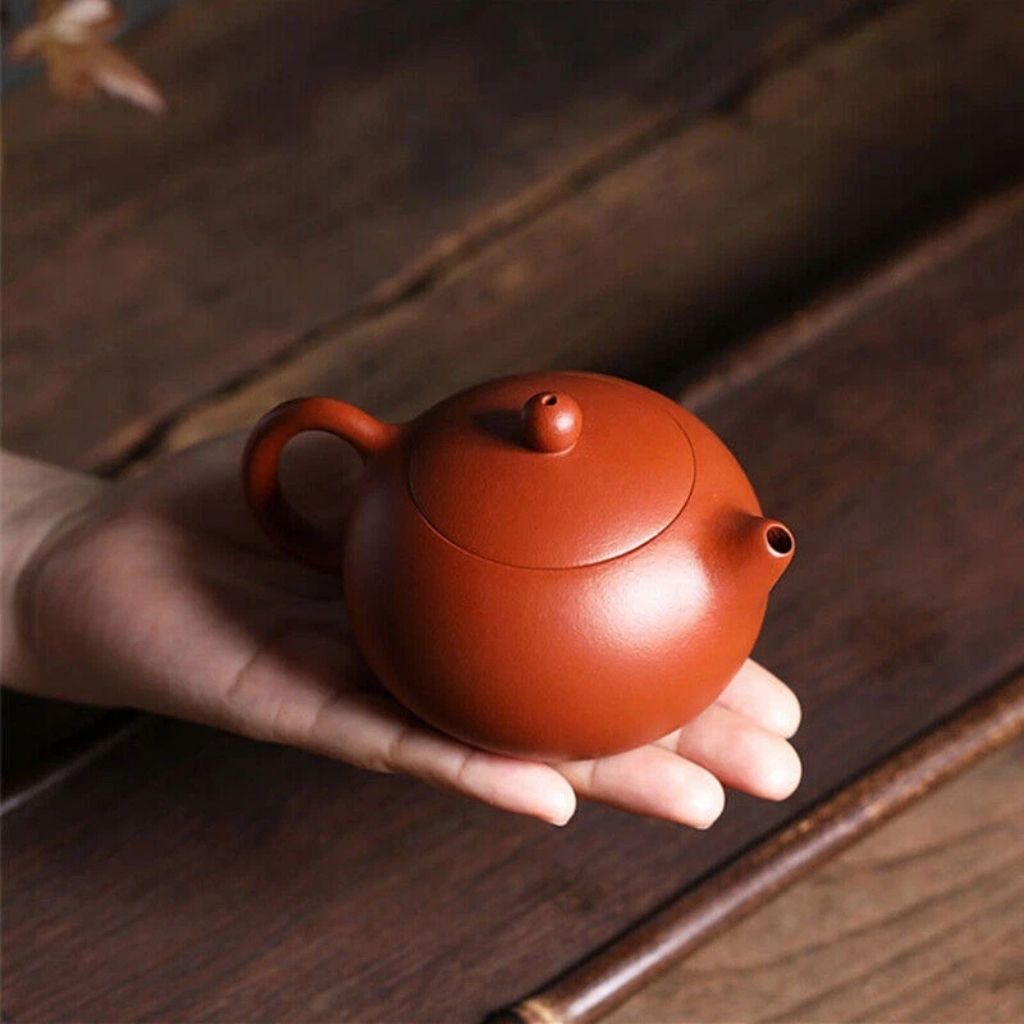 Traditional red clay ceramic teapot with classic design elements, crafted for authentic kung fu tea brewing