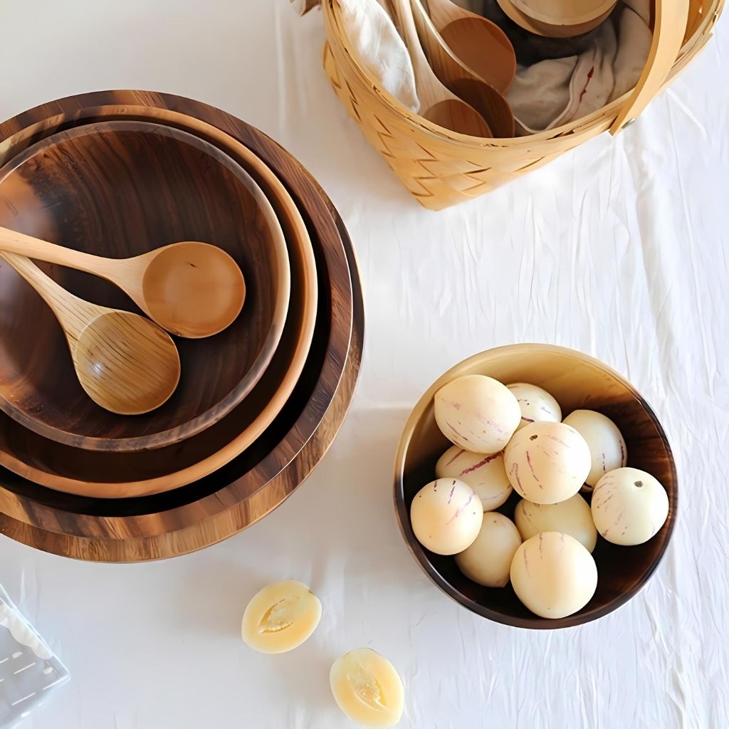 Wooden bowls and spoons on a white surface