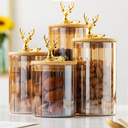 Transparent amber jar with linear stripe detail and wildlife themed lid