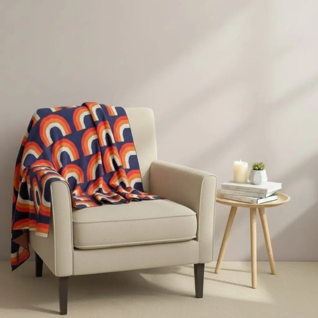 Rainbow knit blanket with multicolor arch pattern made from soft cotton for home decor