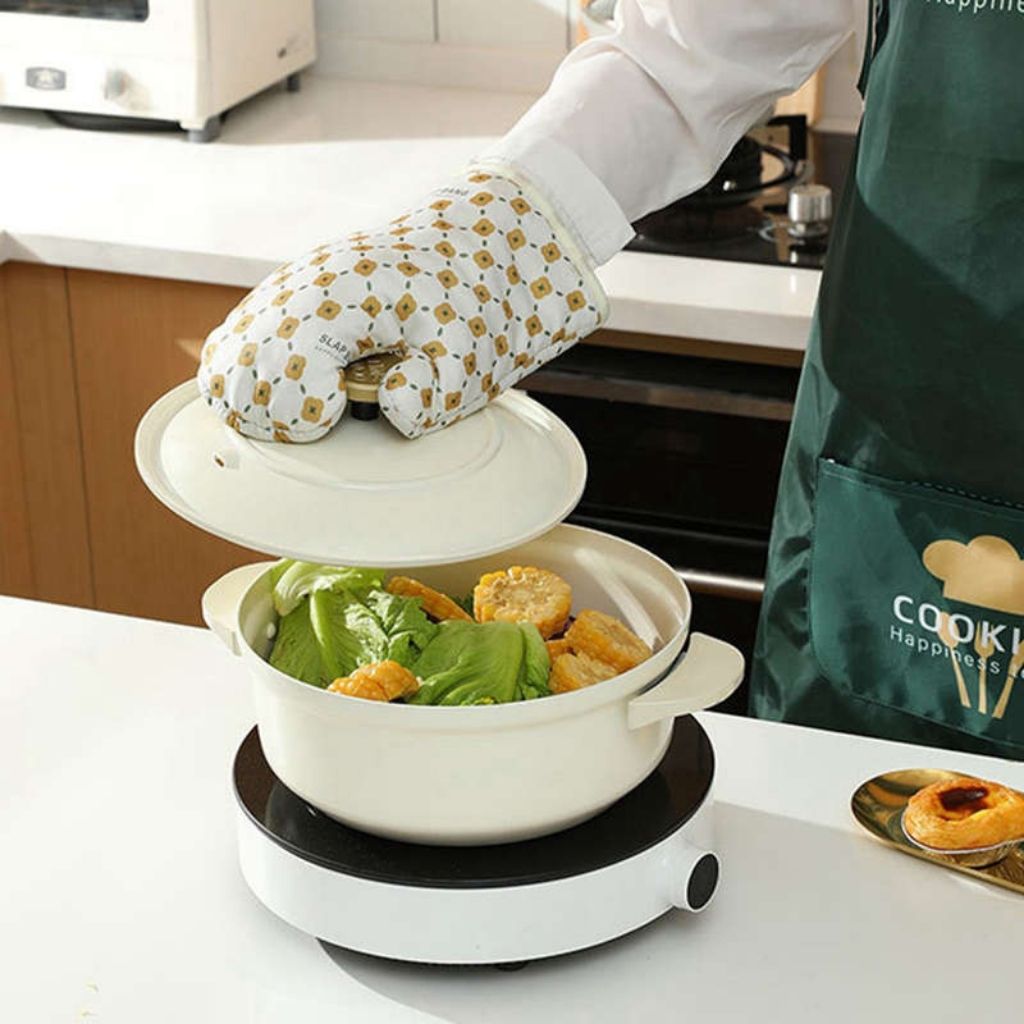 Heat resistant cooking gloves with anti-slip silicone grip, perfect for handling hot cookware safely