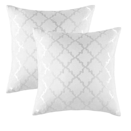 Modern geometric pillow covers arranged on sofa showcasing polyester fabric and contemporary design appeal