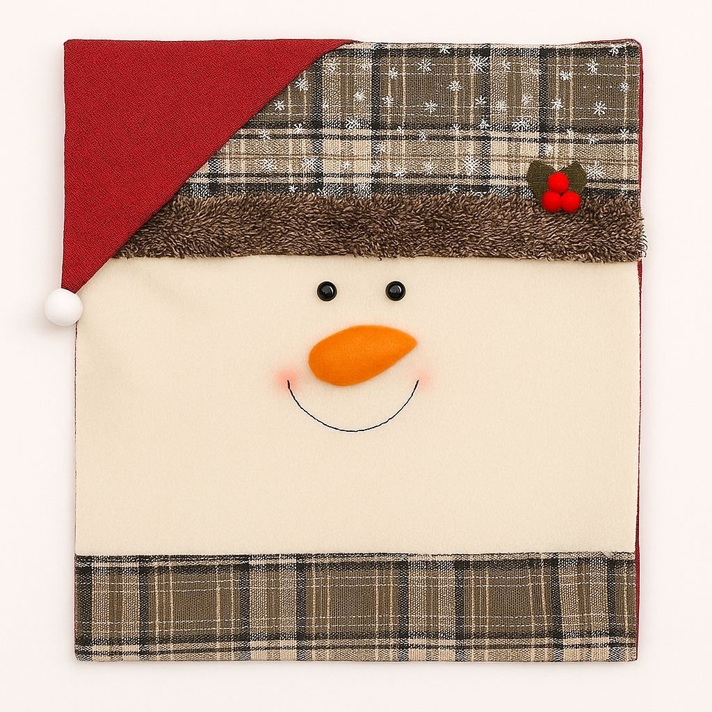 White snowman chair cover with black hat and orange carrot nose on dining chair