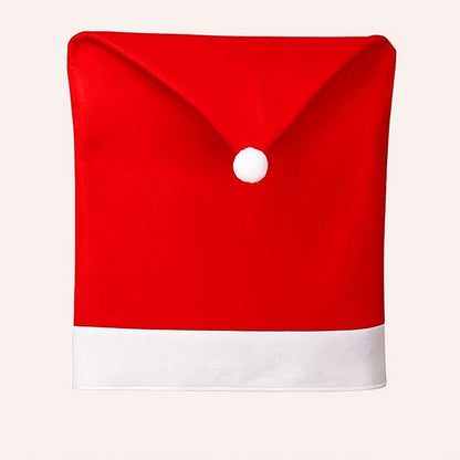 Red Santa hat shaped chair cover with white fur trim and pom pom