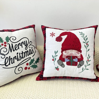 Seasonal cushion cover with embroidered holiday greeting and plaid edge