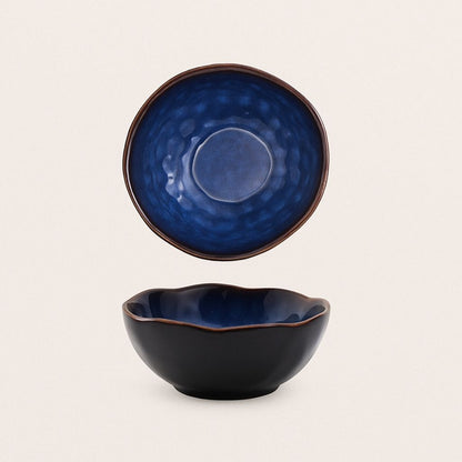 Artisan ceramic bowl featuring irregular sculptural design, handmade tableware for creative dining